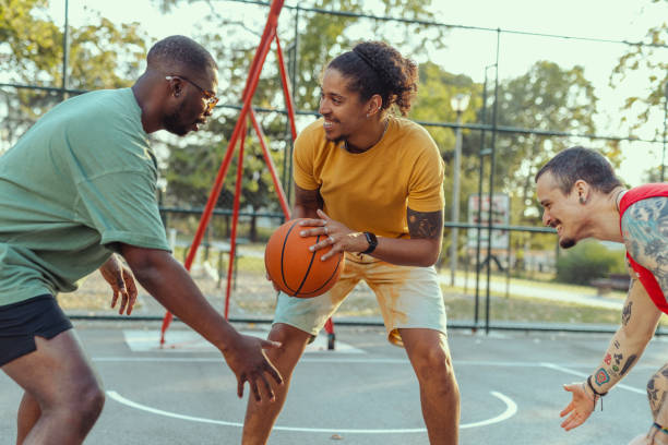 istock Young men playing basketball 2150266386