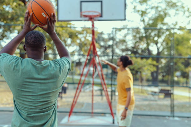 istock Young African American man shoot a basketball 2150266770