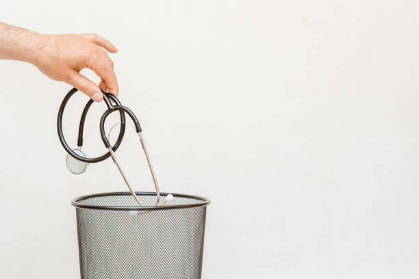 istock The stethoscope is thrown into the trash for disposal and recycling.White background,selective focus,copy space. 2150267357