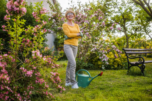 Portrait of happy senior woman gardening.