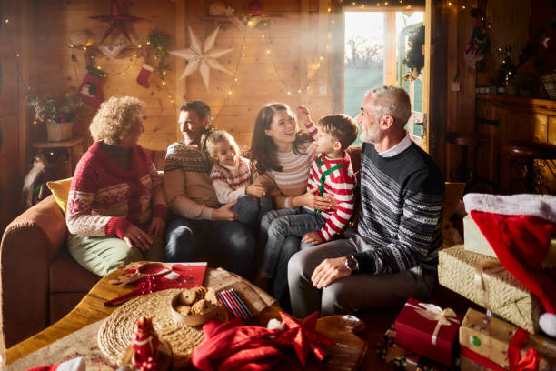 istock Happy multi-generation family talking during Christmas at home. 2150269489