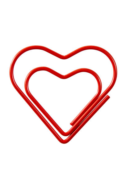 Heart Shaped Paperclip Over White Background