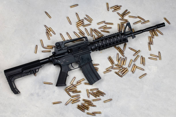 istock M4 carbine and 5.56mm shells and magazine with bullets 2150270605