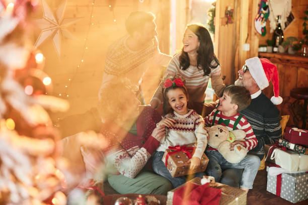 istock Happy extended family talking on Christmas dat at home. 2150270645