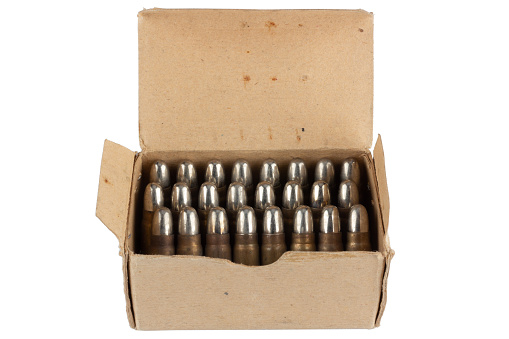 Vintage retro ammunition in a cardboard box. Isolated on white background.