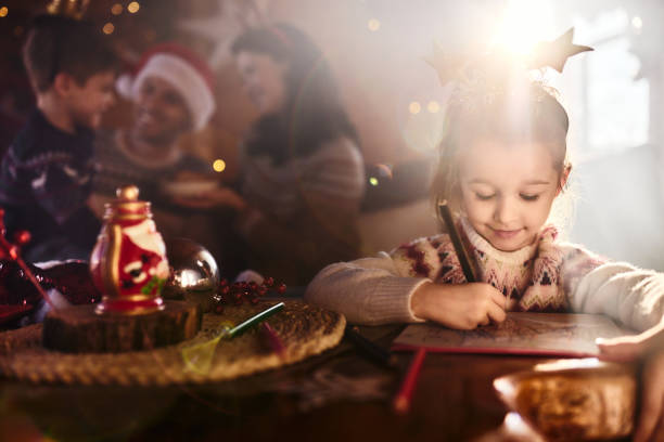 istock Smiling girl having a creative time on Christmas day. 2150270841