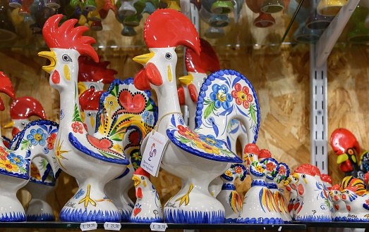 Lisbon, Portugal - March 12, 2024: Traditional souvenir objects in a small business retail display in the market. The city is known for the quality of its ceramics
