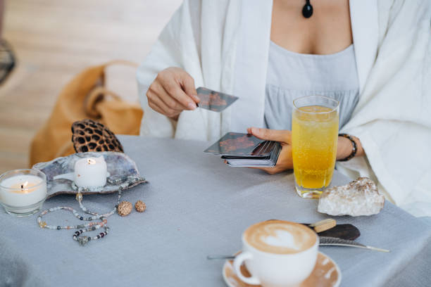 istock Female hands are holding tarot cards 2150271529