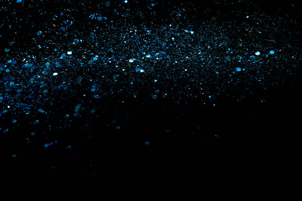 istock Blue sparkles or glitter over black cosmic abstract background. 2150271671