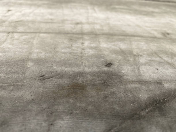 istock Detailed image showing the rough texture and patterns of a concrete surface 2150271685