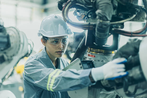 istock Engineer working machine assembly in advance technology robotic factory industry, Service maintenance robot arm cable part 2150272825