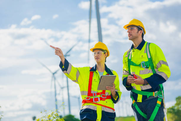 istock professional engineers working service maintenance wind turbines. Clean energy for future. Alternative eco natural power generator worker people concept 2150272875