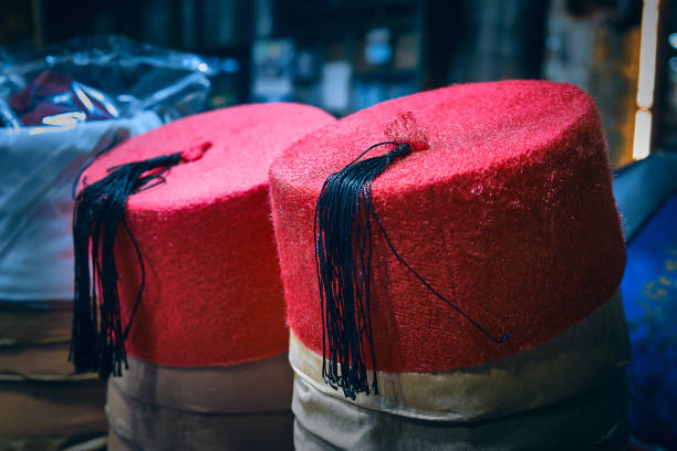 Traditional egyptian hat tarboosh for sale. Arabian fez at night egyptian market. Khan El Khalili market, Cairo, Egypt