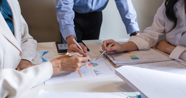 istock Business team meeting where the team leader is presenting a work plan graph. Discuss and summarize work results in the conference room. 2150276273