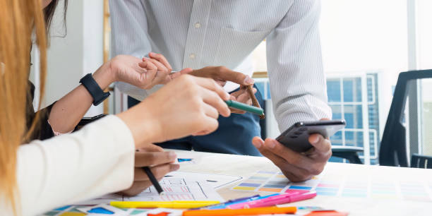 istock team of UI UX web designer are working together to develop mobile responsive websites with UI UX front end designer previews 2150276700