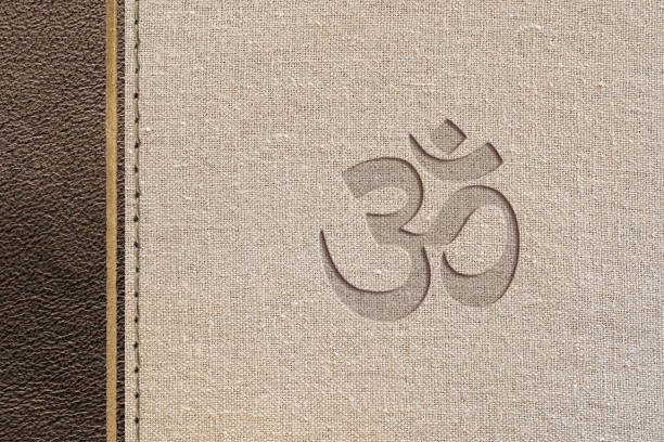 Brown hindu religious design with leather and fabric texture with hindu symbol engraved. Top view.