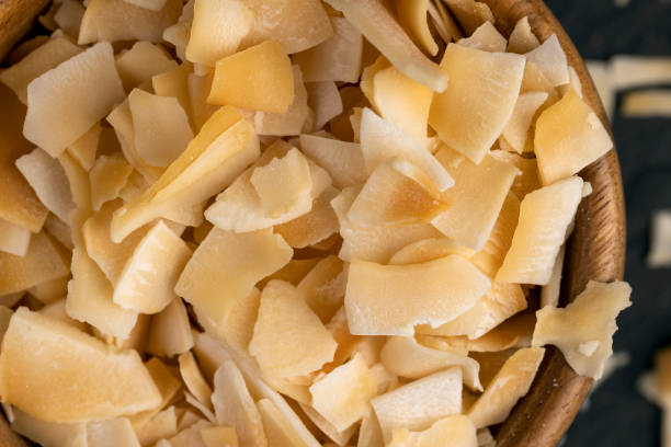 istock sweet orange and yellow coconut flakes fried in sugar 2150280932