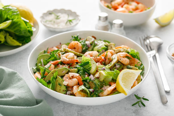 istock Shrimp avocado salad with lettuce and arugula. 2150281195