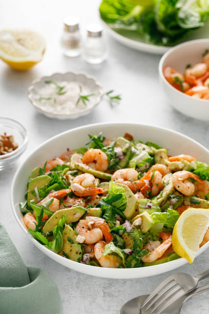 istock Shrimp avocado salad with lettuce and arugula. 2150281211