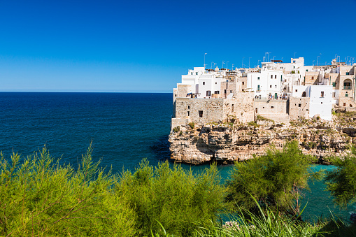 Polignano a Mare, in southern Italy, is renowned for its cliffside old town, crystal-clear waters, and charming beaches. It's a picturesque destination blending natural beauty with cultural charm.