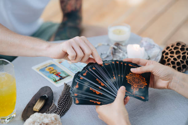 istock A bald woman reading tarot 2150282491