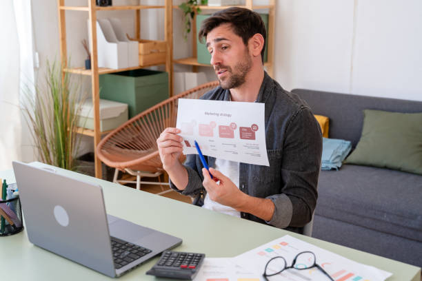 istock Confident businessman presenting marketing strategy document 2150283019