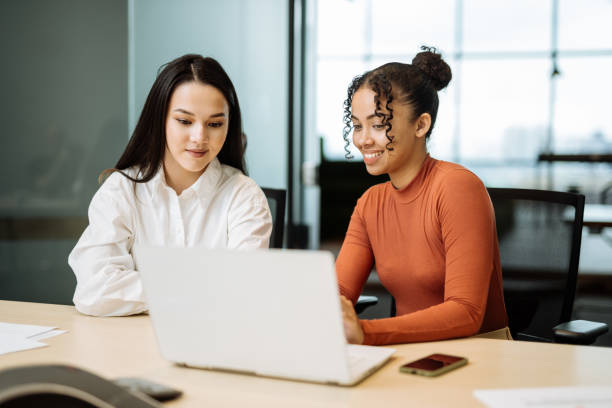 istock Diverse business people in modern office, working together and sharing information 2150283103
