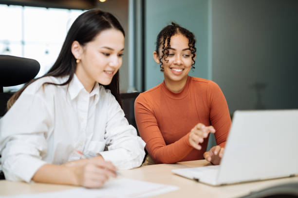 istock Diverse business people in modern office, working together and sharing information 2150283120