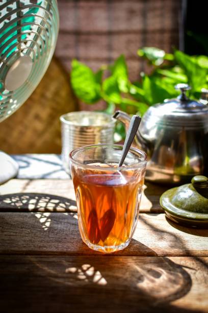 istock Thai hot tea on wooden blackground, retro style , morning light 2150284742