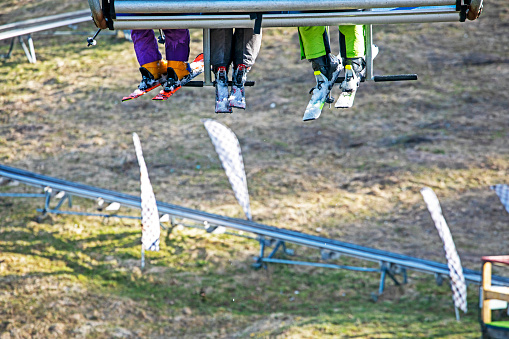 close up of a family of skiers on a ski lift. Leisure