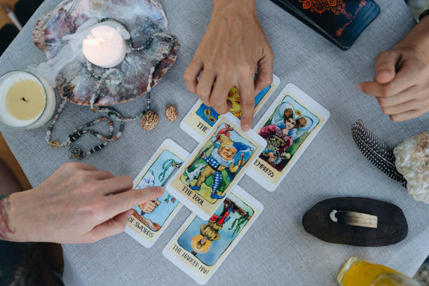 istock A bald woman reading tarot 2150285364