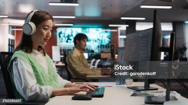 Compter Games Programmer Female Asian Game Programmer Coding On Desktop Computer In Game ...