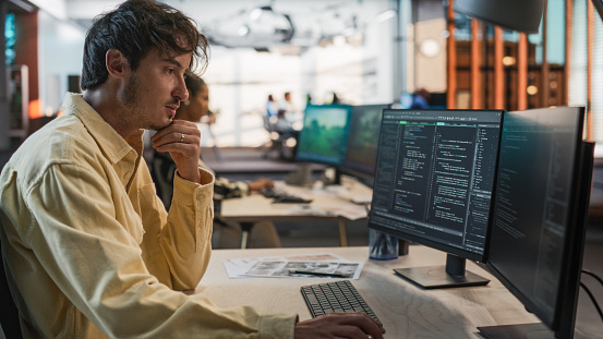 Game Design Programer Male Caucasian Game Programmer Coding On Desktop Computer In Game ...