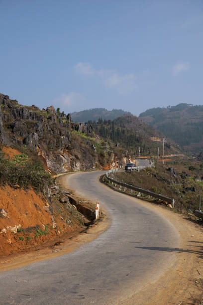 istock Curving road of Ha Giang loop with one cliff side and one mountain side 2150287350