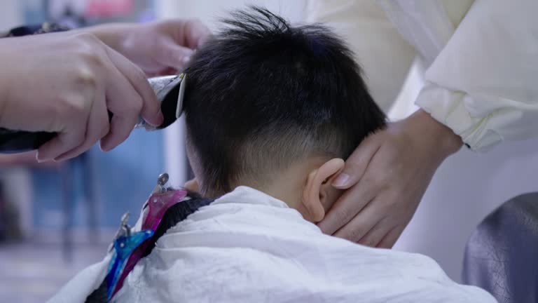On the second day of the second lunar month in the Chinese calendar, a child is getting a haircut