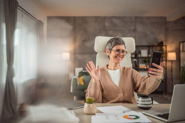 istock A mature woman works from her home office 2150288027