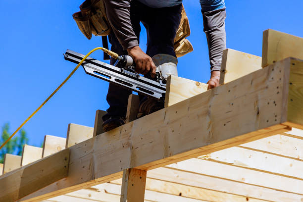 istock Framer worker installing beams using air nails hammer in a nailing wooden frame 2150289761