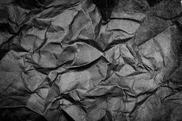 istock Black Paper Texture background. Crumpled Black paper abstract shape background. 2150289889