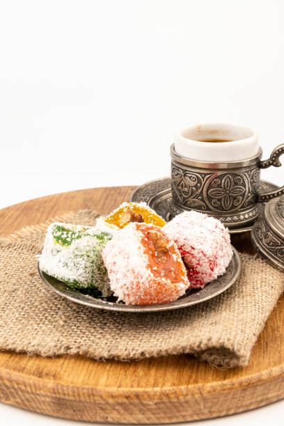 istock Turkish Coffee with Turkish Delight on authentic metal plate, isolated on white background 2150292035