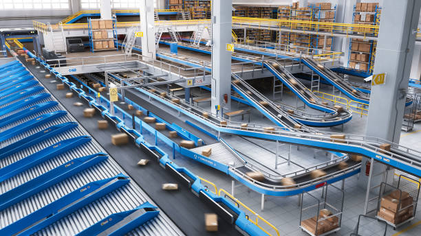 istock Automated Conveyor Belt Sorting Mechanism in a Logistics Center. Automatic Engineering Solution Handling and Preparing Parcels for Delivery to Clients. Warehouse Shot 2150292242