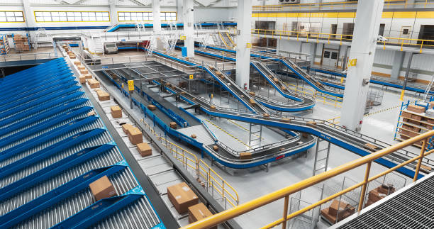 istock Modern Delivery Logistics Warehouse with Working Automated Conveyor Belt with Retail Parcels, Cardboard Boxes and Online Shopping Orders Being Prepared for Shipping 2150292464