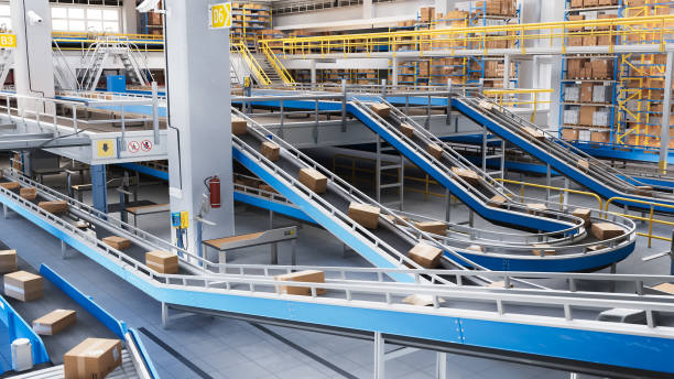 istock Modern Delivery Logistics Warehouse with Working Automated Conveyor Belt with Retail Parcels, Cardboard Boxes and Online Shopping Orders Being Prepared for Shipping 2150292473