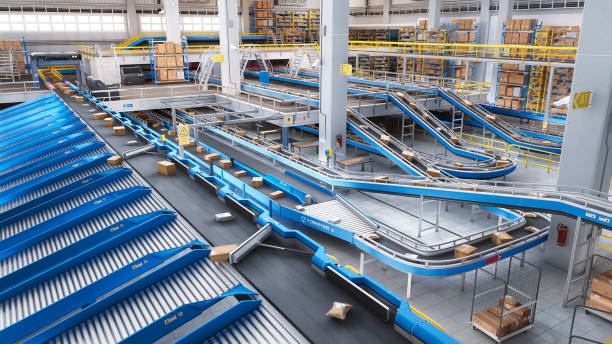 istock Modern Delivery Logistics Warehouse with Working Automated Conveyor Belt with Retail Parcels, Cardboard Boxes and Online Shopping Orders Being Prepared for Shipping 2150292495