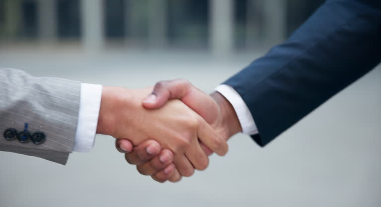 Interview, handshake or business people in city zoom for hiring meeting, welcome, or startup deal negotiation. Closeup, thank you or men shaking hands in b2b support, collaboration or crm partnership