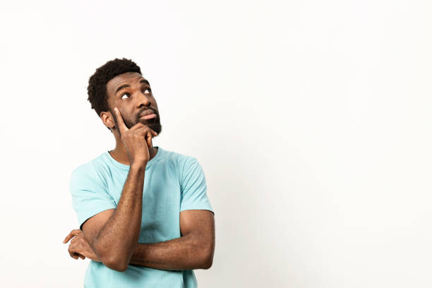 istock Thoughtful Man Pondering Ideas in Casual Setting 2150299836
