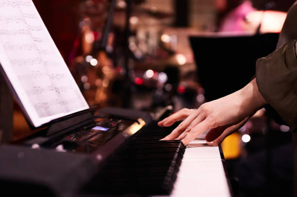 istock Musician's Hands on Piano Keys at Concert 2150300919