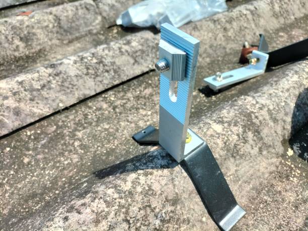 istock Installing a roof mounting kit for installing solar panels. 2150300928
