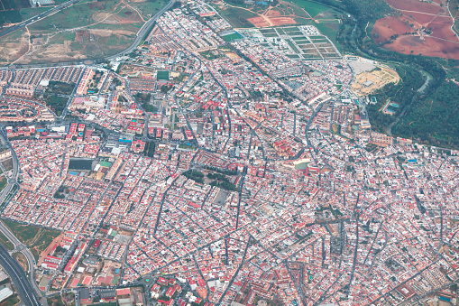 Flying over residential district of Seville, Andalusia Spain. European city view from above