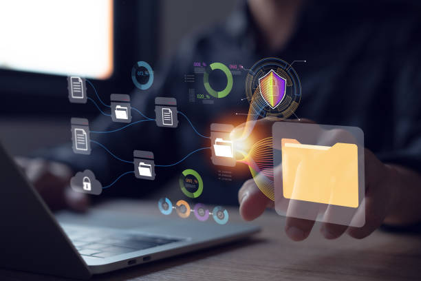 istock Secure file storage technology Document Management System (DMS) Businessman uses laptop with online database folder to store digital document data files. 2150303146