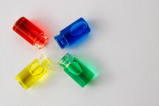 Bottles with yellow, red, blue and green ink